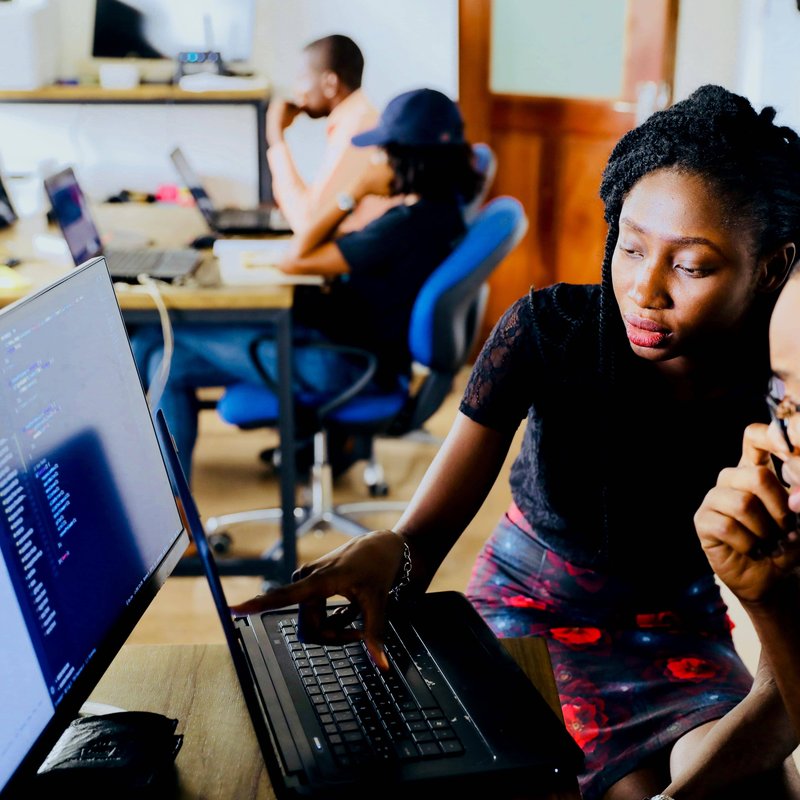 Man and woman in front of laptop