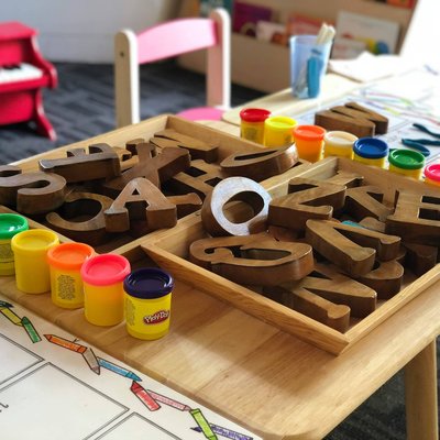 Toys lie atop a table in a kindergarten classroom