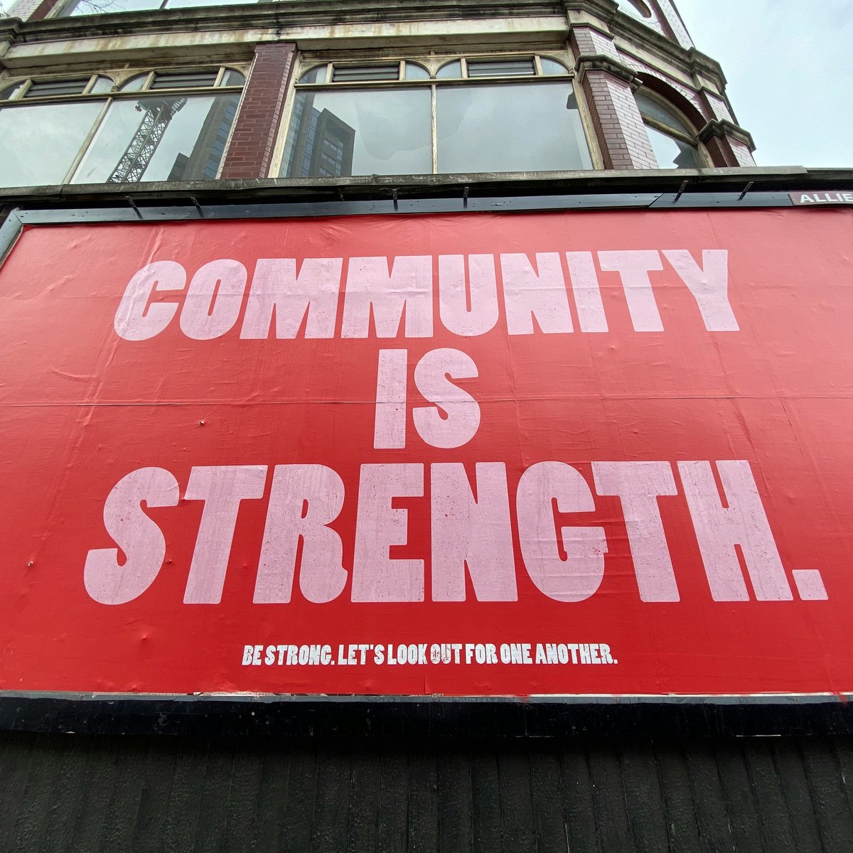 Billboard with the words "Community is Strength"