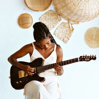 Woman playing a guitar